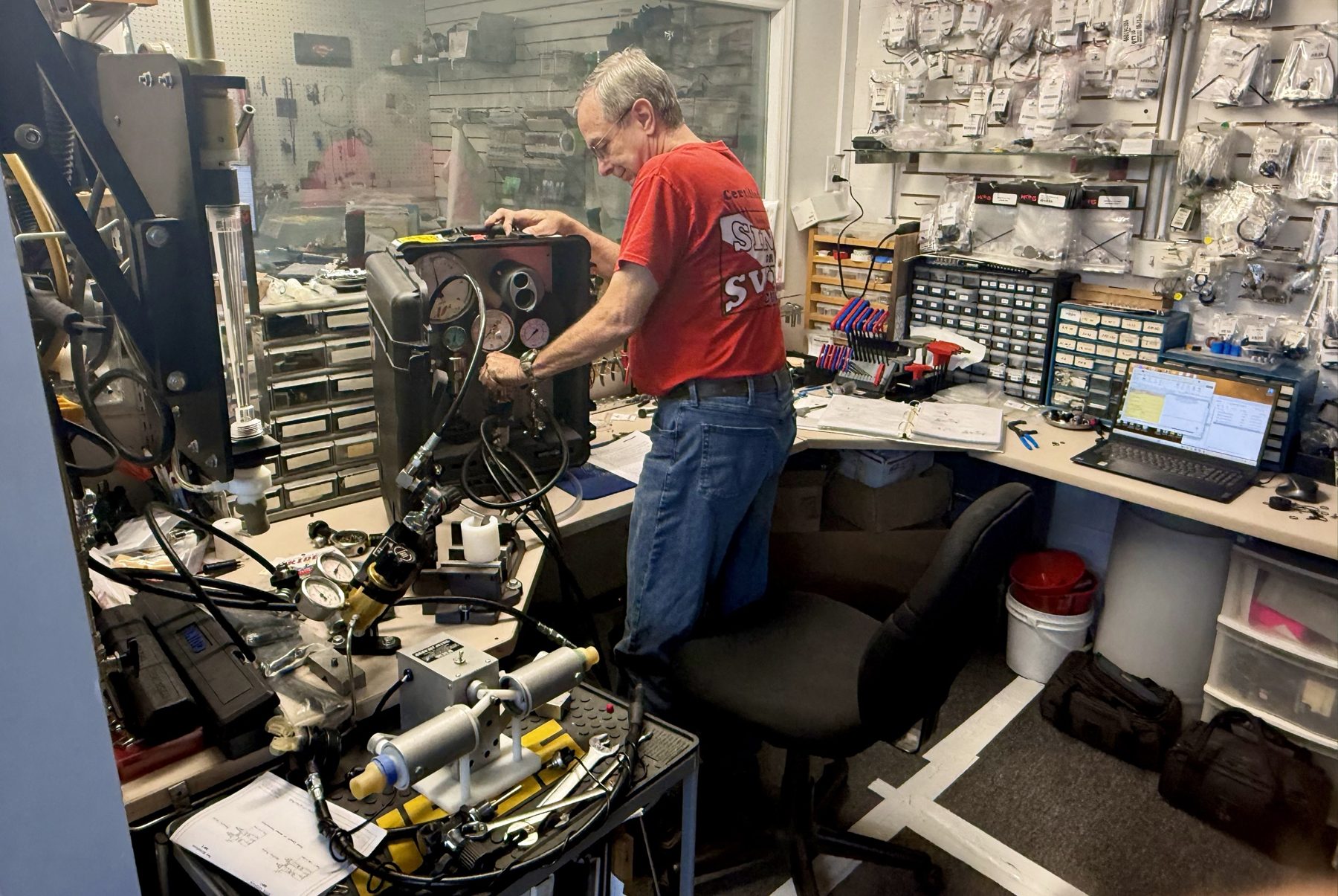 Sink or Swim Scuba technician at the Interspiro test bench in the Gastonia NC service center