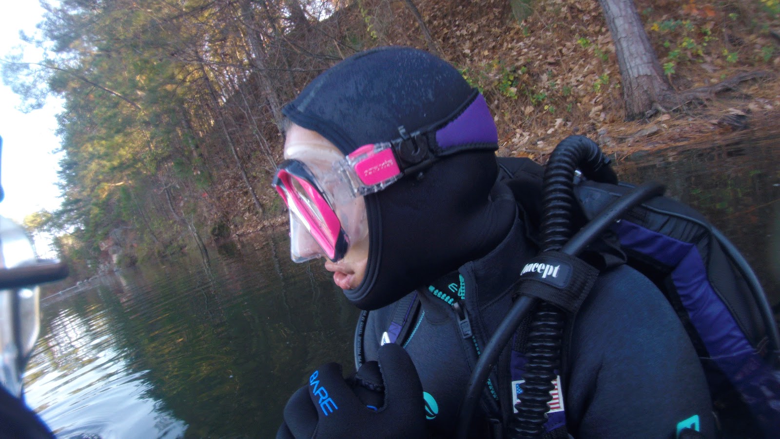 Open water scuba dive, North Carolina lake Scuba diver in a hood and mask preparing for an open water dive at a North Carolina lake