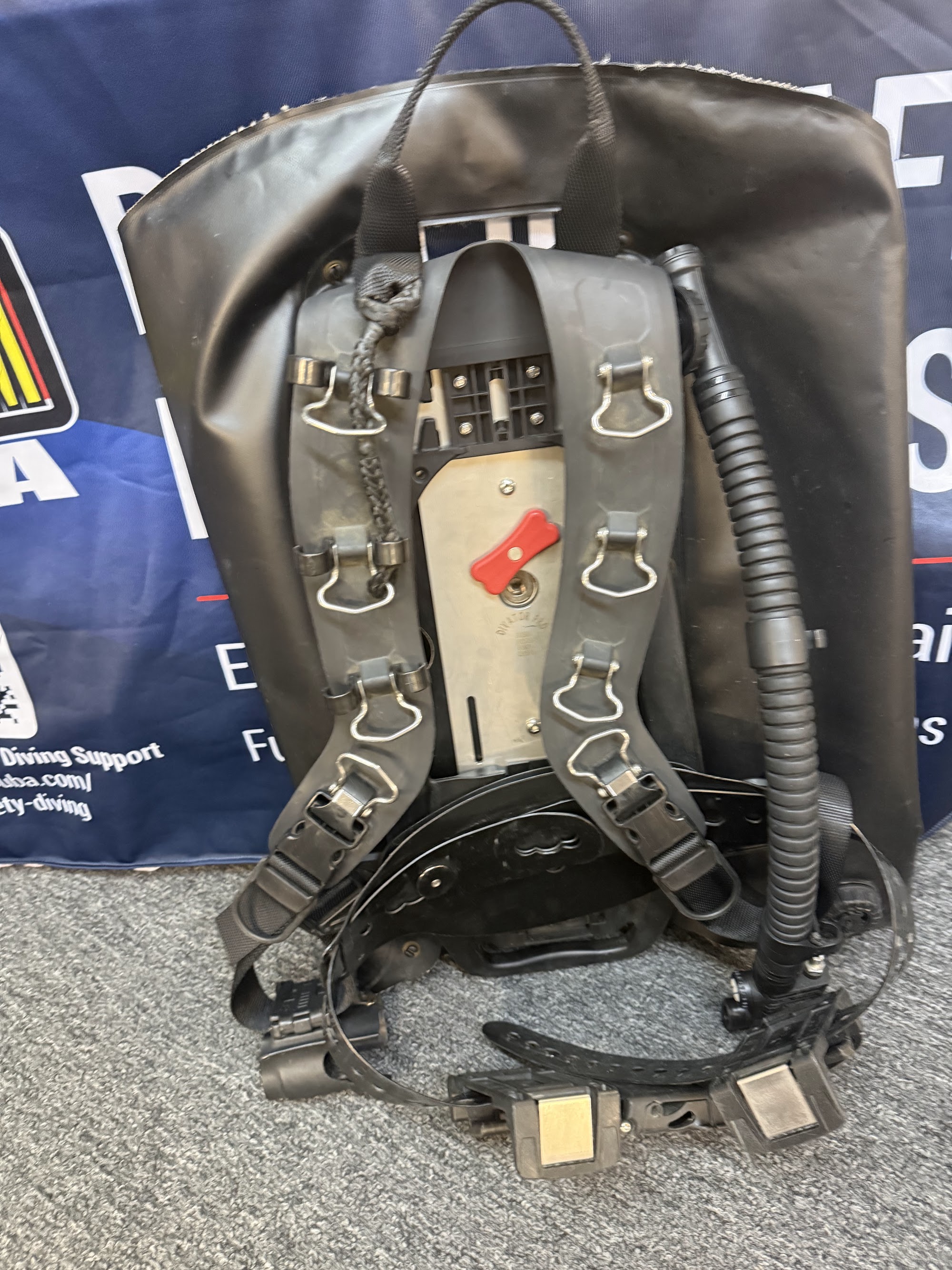 Public safety diver backplate and harness Public safety diver backplate and harness rig with red quick release handle