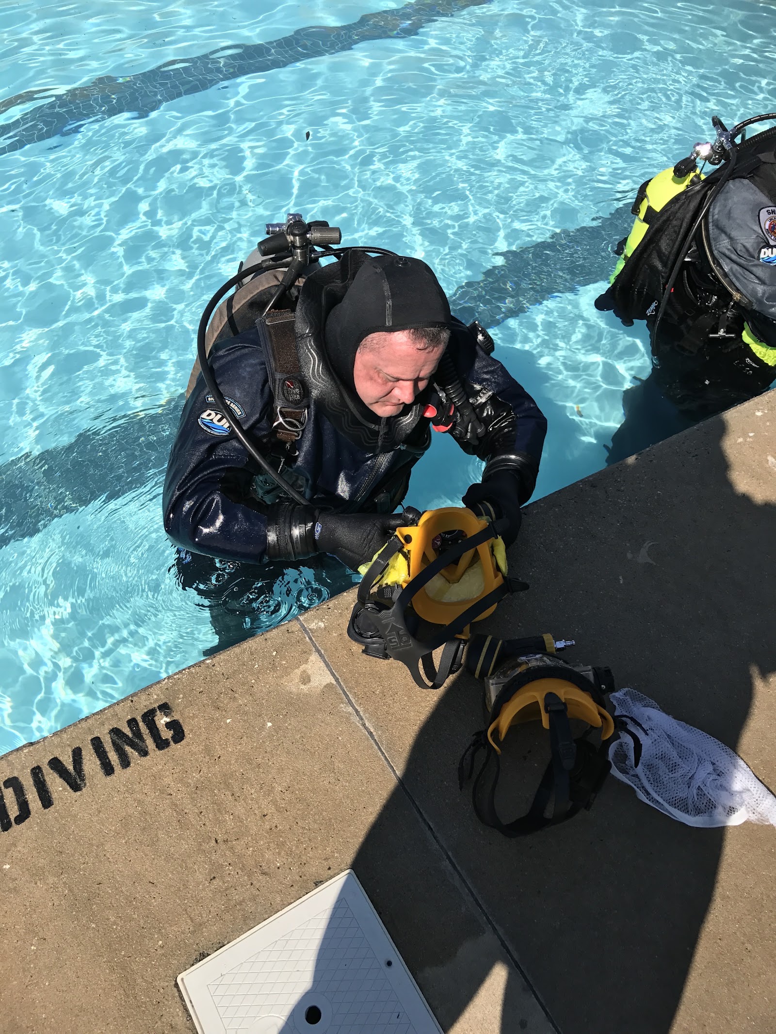 Public safety diver in an Interspiro full face mask during pool training at Sink or Swim Scuba