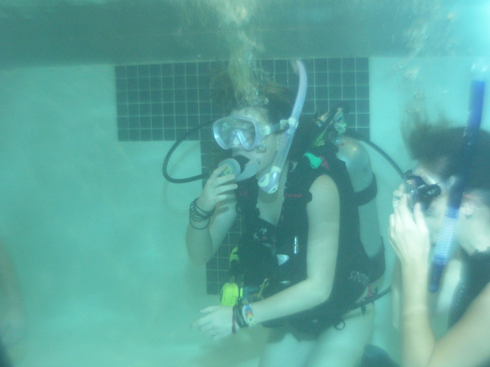 Scuba student pool session, Gastonia NC Student practicing regulator skills underwater in a scuba class pool session