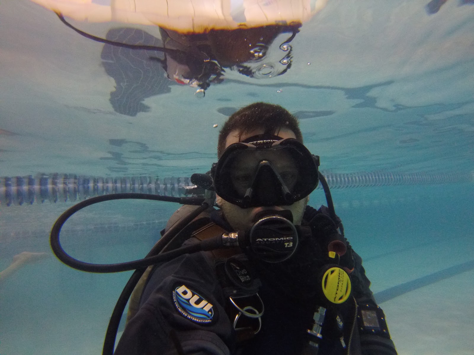 Scuba diver in a DUI drysuit underwater in a pool at Sink or Swim Scuba
