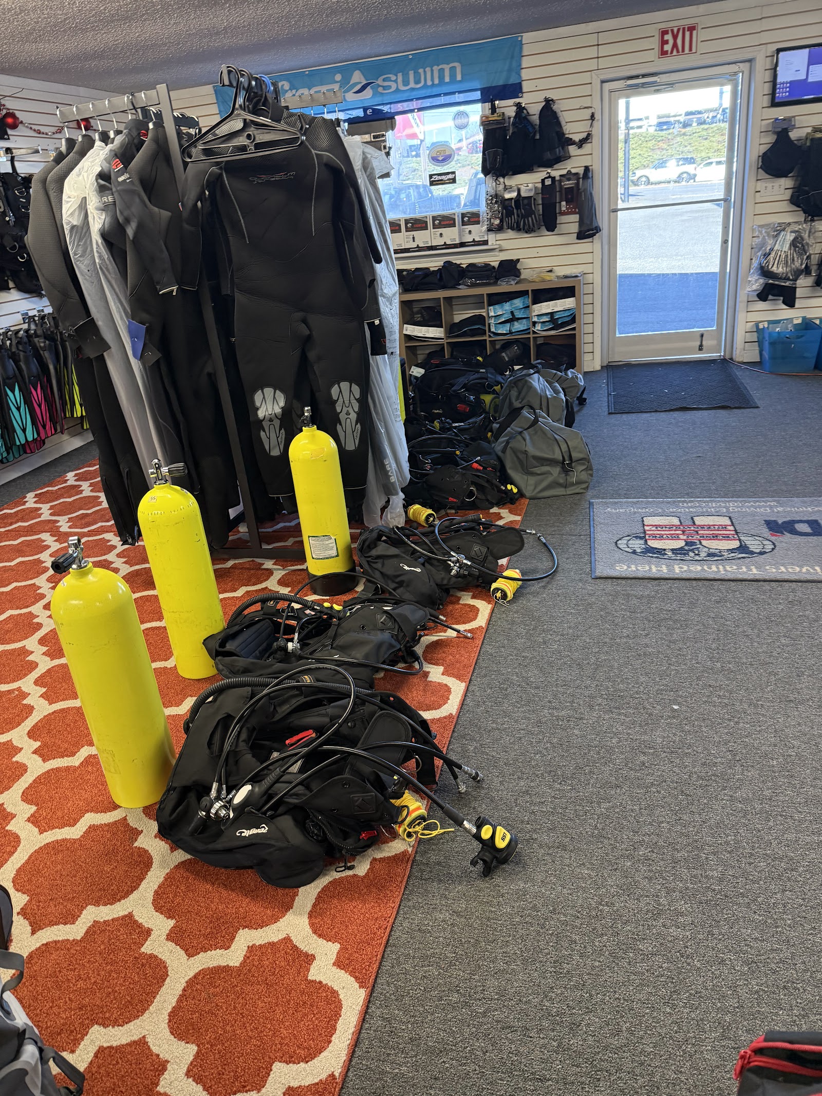 Scuba gear at Sink or Swim Scuba, Gastonia NC Scuba tanks, BCDs and wetsuits on display inside Sink or Swim Scuba dive shop in Gastonia, NC